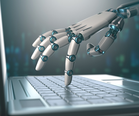 Robot hand typing on laptop to evoke the idea of artificial intelligence and robotics.