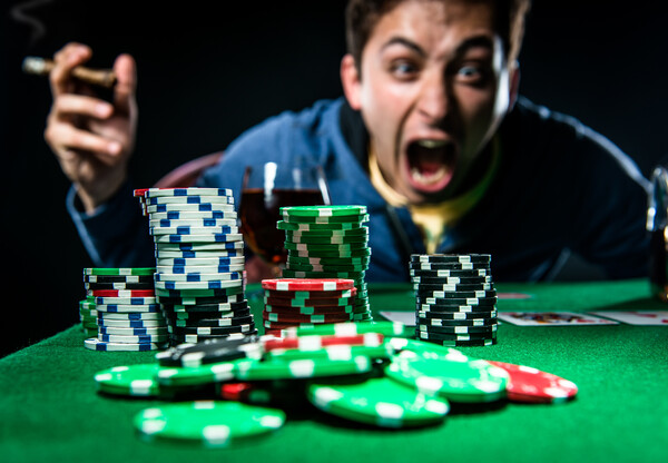 Poker player yelling at poker chips