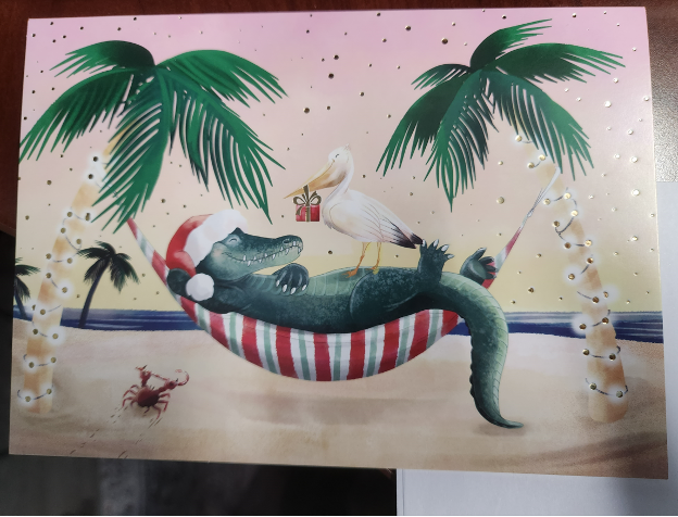 Christmas card with a crocodile and a stork with a present.